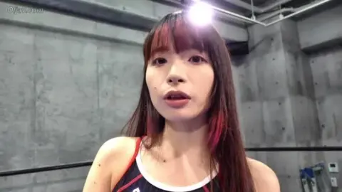 Asian Women Wrestling in Ring