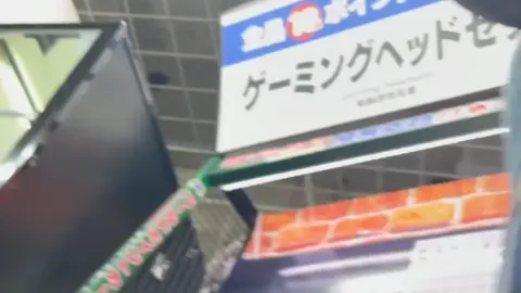 Asian Man in Plaid Shirt Shopping