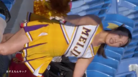 Asian Cheerleaders in Yellow Uniforms Dancing