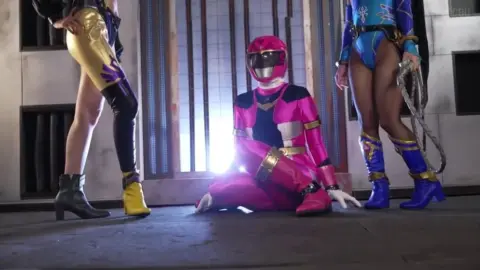 Asian Performers in Costumes Engage in Intimate Scenes