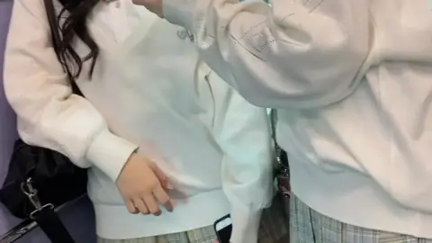 Asian Teens in Plaid Skirts on Subway