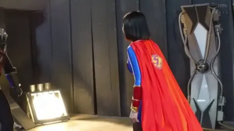 Asian Cosplayer in Superman Outfit