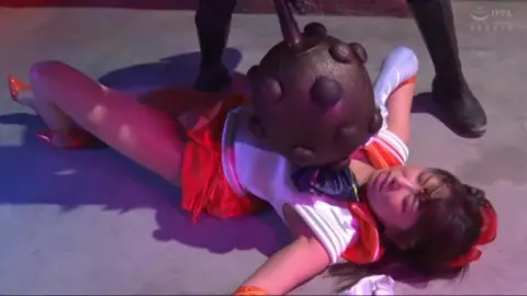 Asian Couple in Bondage and Domination Scene