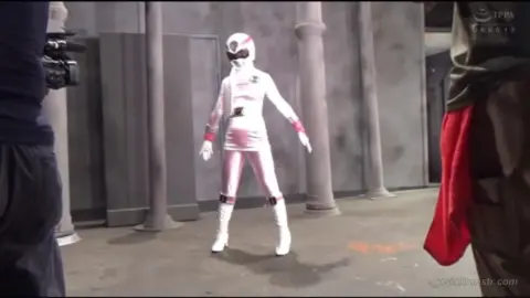 Asian Cosplay Duo in Pink Costumes