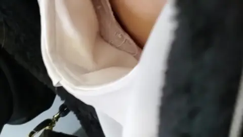 Asian girl in ripped jeans and gold necklace