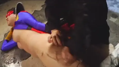 Asian Duo in Superhero Costumes Engage in Intimate Encounter
