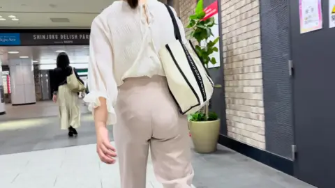 Asian Women in Public Building Encounter