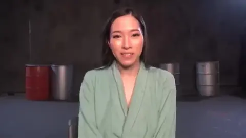 Asian Girl in Bondage and Superhero Costume