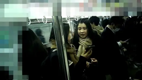 Asian Women on Crowded Train
