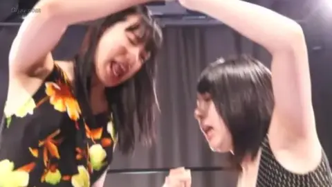 Asian Lesbians Wrestling in Ring