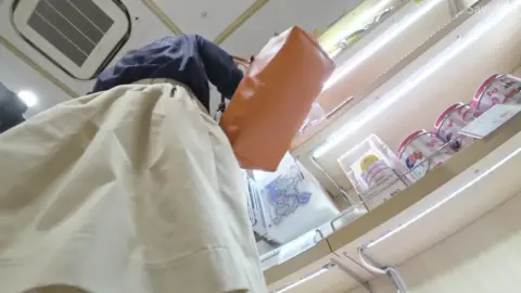 Asian Girl in Yellow Skirt Exposed in Convenience Store