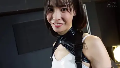 Asian Duo in Leather Engage in Erotic Play