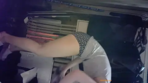 Caucasian Woman in Cage and Bondage Scene