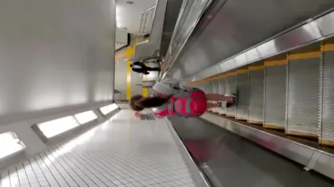 Asian teens on subway escalator