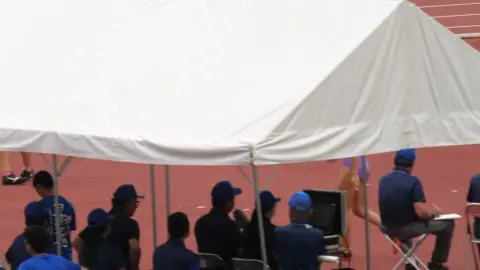 Group of Women Walking and Standing Outdoors