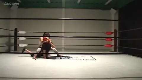 Dark-Haired Women Engage in Wrestling Match
