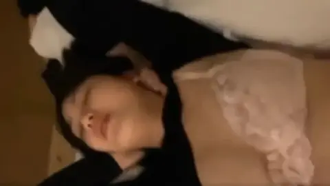 Asian Couple Intimate Moment in Bedroom