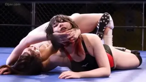 Asian Women Wrestling in Ring
