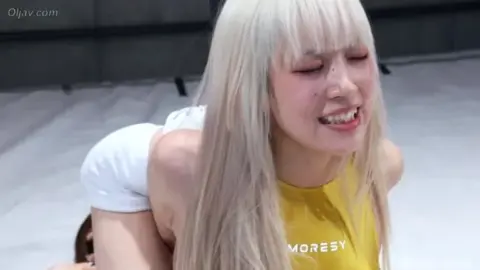 Blonde and Brunette Wrestlers in Yellow and Blue