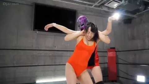Asian Lesbians Wrestling in Ring