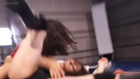 Asian Women Wrestling in Ring