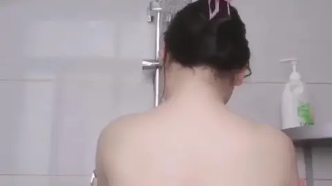 Asian Girl Showering in Bathroom