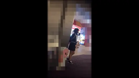 Asian girl in clothing store