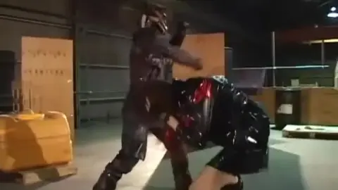Masked Asian Performers Engage in Fights