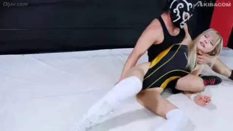 Wrestling Match Between Blonde Female and Male Performer