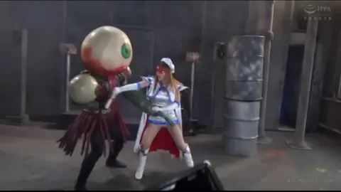 Asian Women in Costumes Engage in Fighting Poses