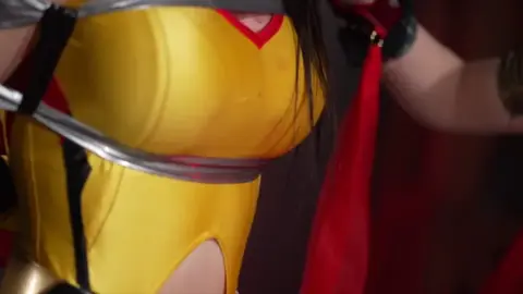 Asian Women in Costumes Engage in Intimate Moments