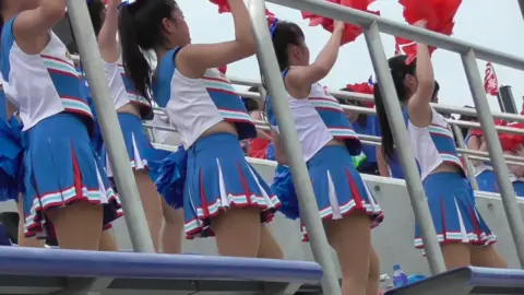 Asian Teen Cheerleaders with Pom-Poms