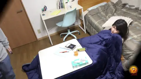 Intimate Moments on Bed and Couch