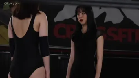 Asian Women Wrestling in Ring