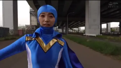 Asian Superhero Couple in Erotic Encounter