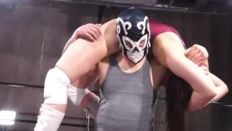 Asian Couple Wrestling in Ring