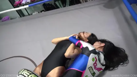 Asian Lesbians Wrestling in Ring