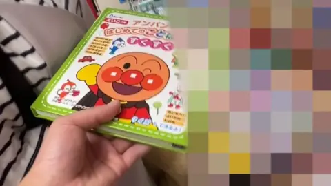 Asian Girl in Mask and Striped Shirt