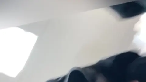 Blonde Teen Sits with Legs Apart and Masturbates