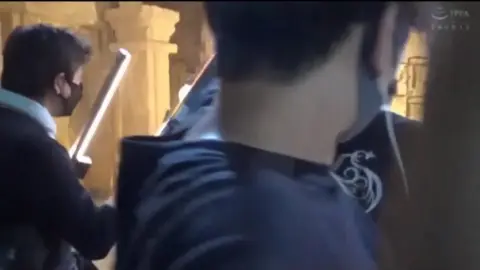 Asian Performers in Colorful Costumes and Masks