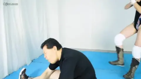 Asian Couple Engaged in Wrestling