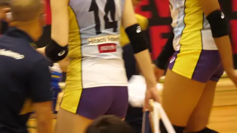 Asian Volleyball Players in Uniform