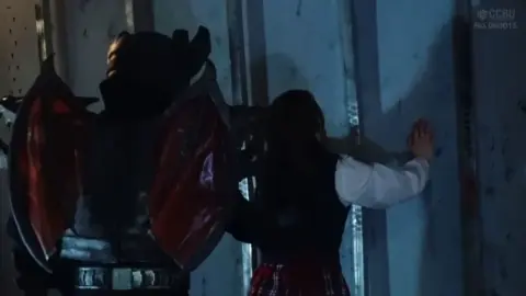 Asian Girl in Armor and Leather Skirt