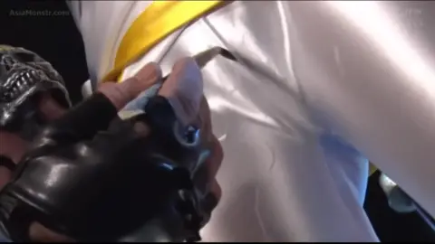 Cosplay Couples in Costumes and Helmets