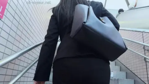 Asian in Black Suit – Public Encounters