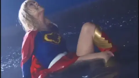 Woman in Superman Costume Erotic Poses