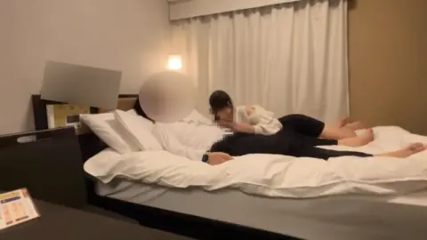 Asian Couple in Hotel Room Intimacy