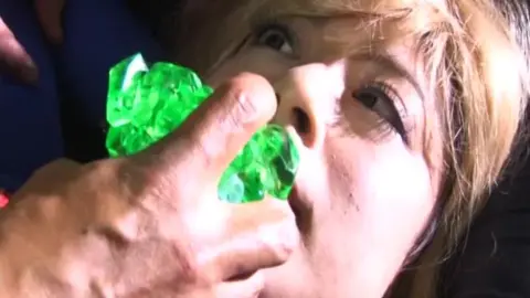 Blonde in Supergirl Costume in Erotic Scene