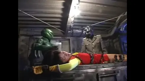 Red Costumed Female vs Alien in Futuristic Setting