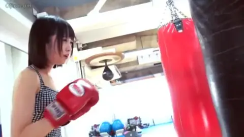 Asian Women Boxing in Gym